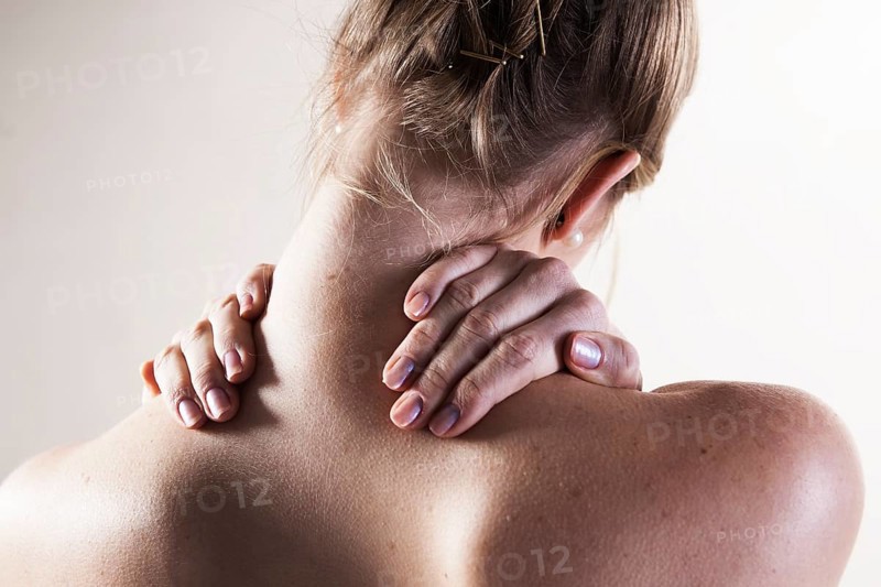 Young woman with neck pain