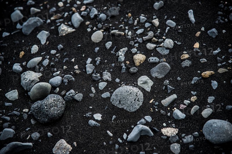 Basalt stones in black lava sand