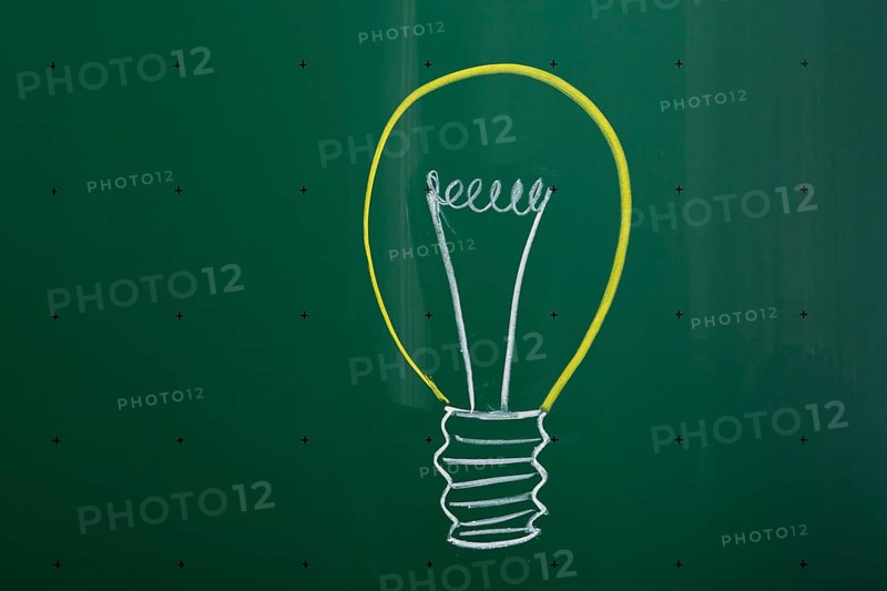 Light bulb drawn with chalk on a blackboard