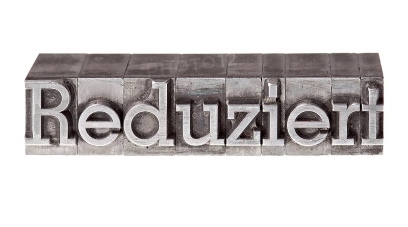 Old lead letters forming the word 'Reduziert'