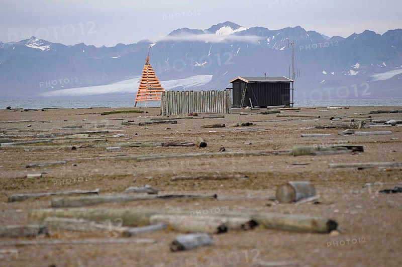 Old trapper cabin with a modern weather station