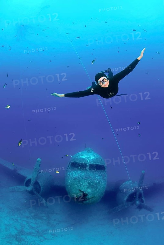 Freediver at plane wreck Douglas Dakota