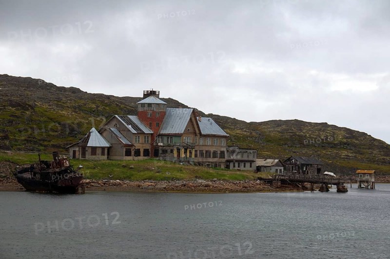 Derelict houses of a rural locality on the Barents Sea
