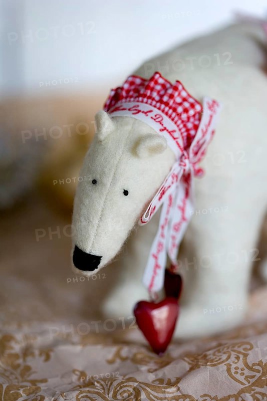 Handmade ice bear with a frilly ribbon