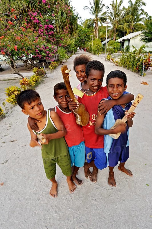 Children with ukulele toys