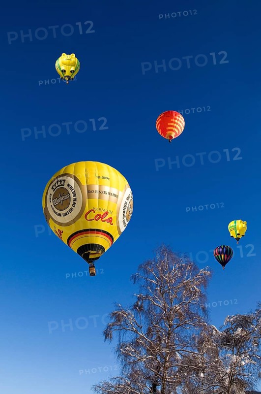 Hot air balloons against a blue sky