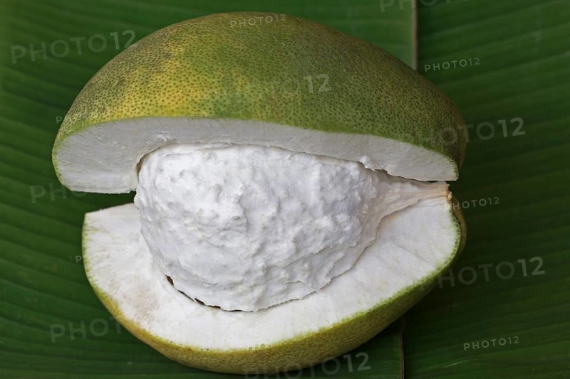 Cut Pomelo fruit on a banana leaf