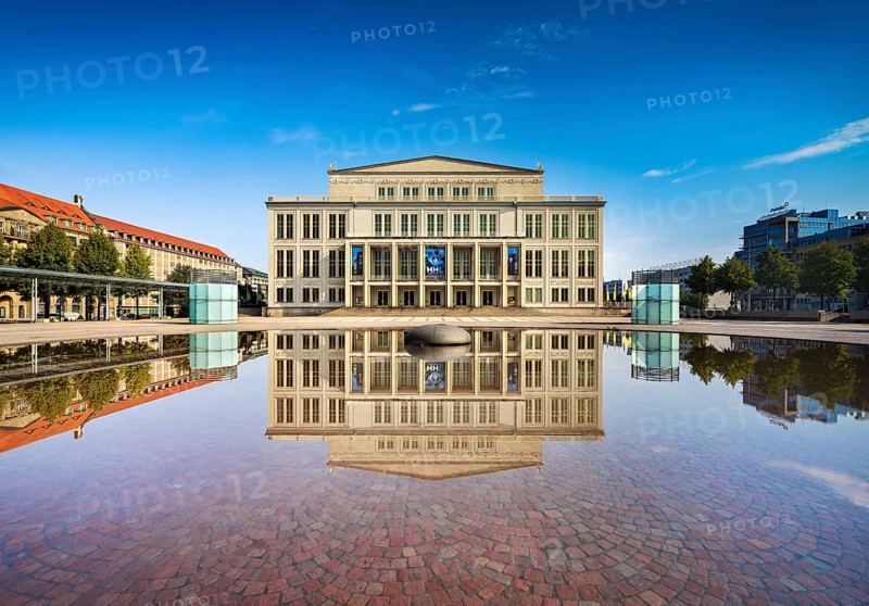 Opera Leipzig with reflection in the water of the Opernbrunnen