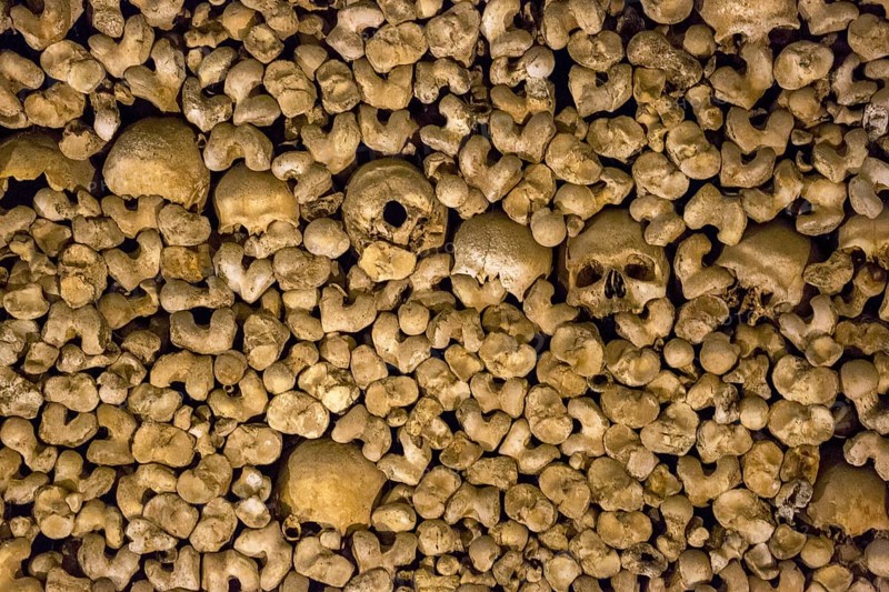 Stacked bones and skulls in the ossuary