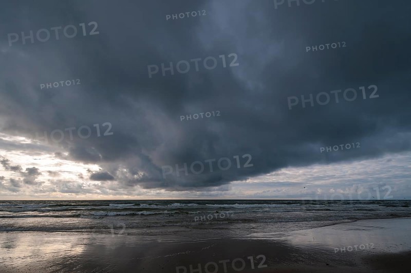 Dramatic cloud formation over a North Sea beach