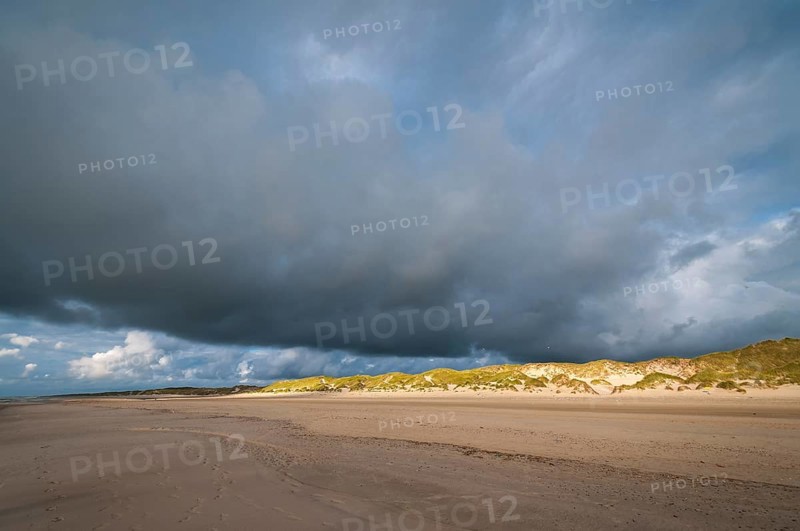 Dramatic cloud formation over a North Sea beach