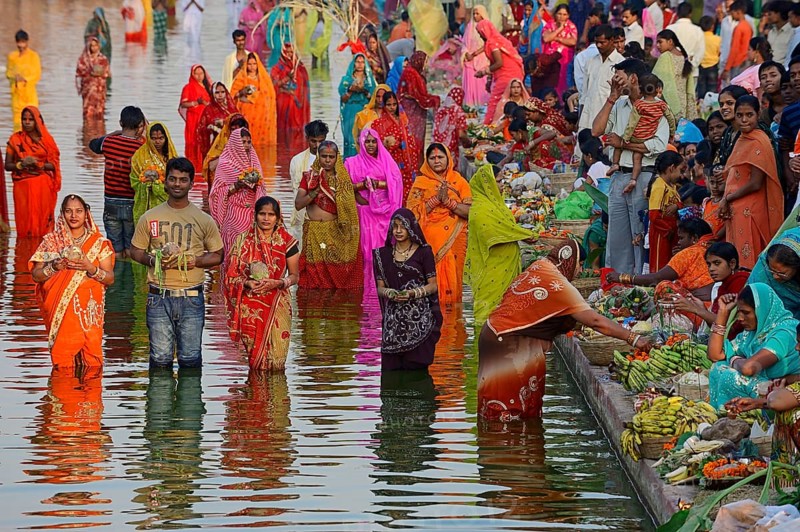 Hindus standing in water during the Hindu Chhath Festival