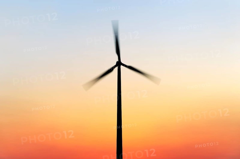 Wind turbine at sunset