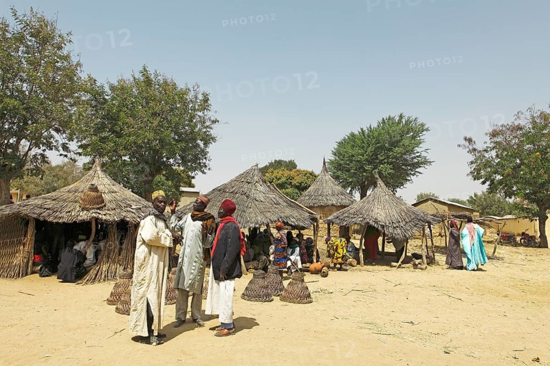 Men wearing traditional Muslim clothing at the market