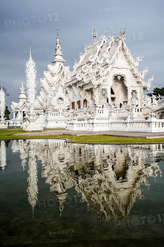 Wat Rong Khun temple or The White Wat with reflection