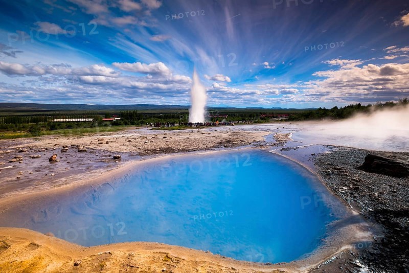 Tourists watching the Strokkur geyser