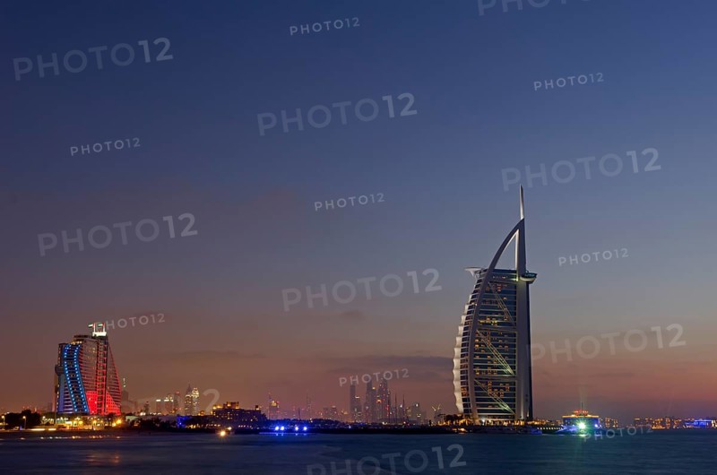 The luxury hotel Burj Al Arab off Jumeirah beach at dusk
