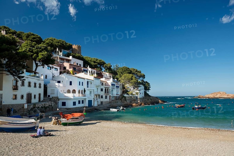 Houses and fishing boats by the sea