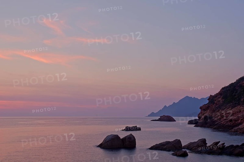 The Gulf of Porto with the surrounding mountains at sunset