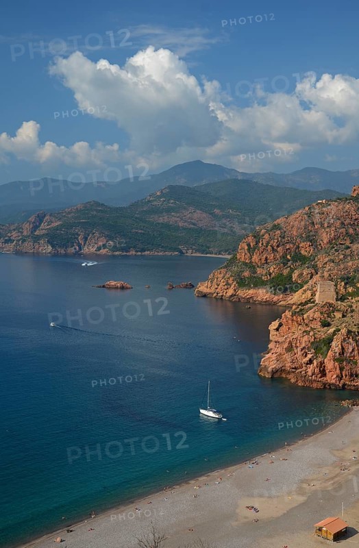 The Genoese Tower of Porto on top of a rocky hill and the Gulf of Porto