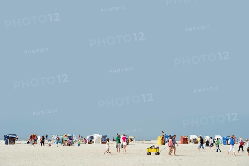 Colourful roofed wicker beach chairs on the beach