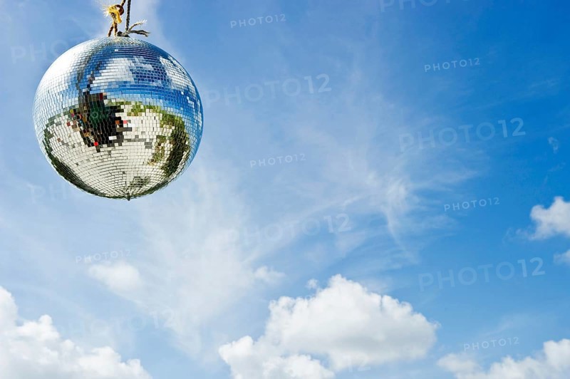 Mirror ball or disco ball against a blue sky