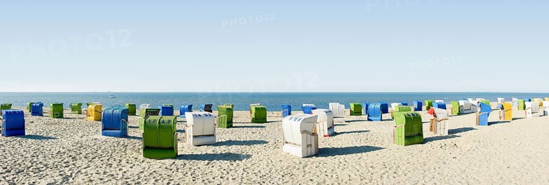 Colourful roofed wicker beach chairs