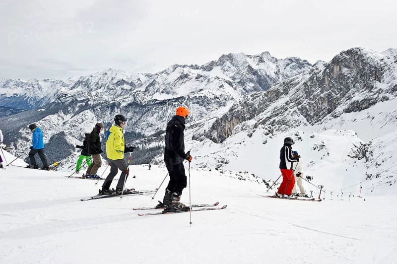 Skiers and mountain landscape at Mt Osterfelderkopf