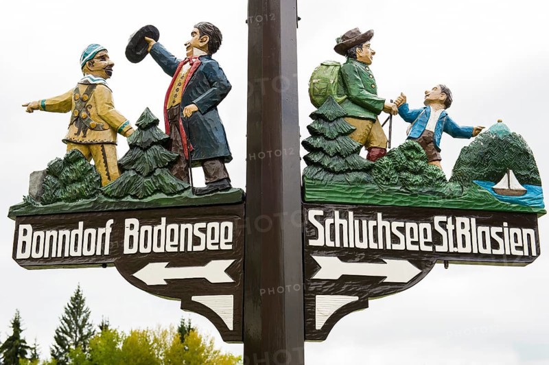 Ornately carved and painted signs