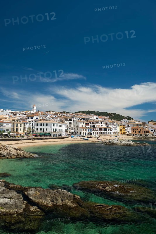 Village with white houses by the sea