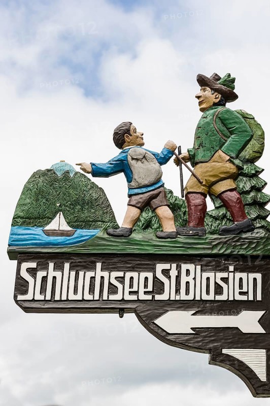 Ornately carved and painted signs