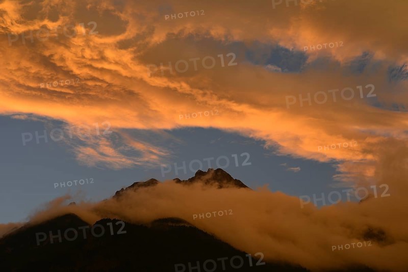 Illuminated clouds above Brandjochspitze mountain