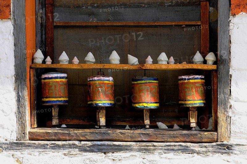 Prayer wheels in the outer wall of a temple