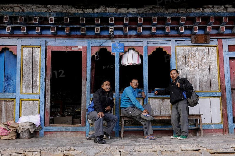 Men outside a shop in the town centre of Mongar