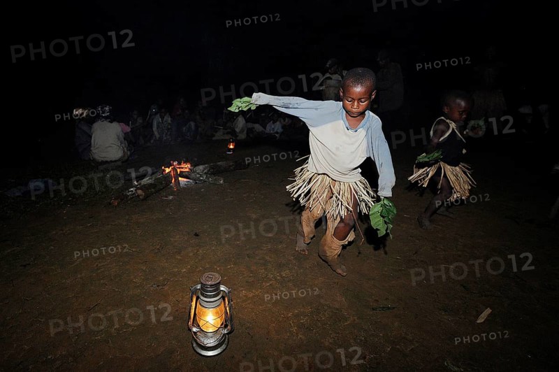 Pygmies of the Bakola people celebrating with song and dance