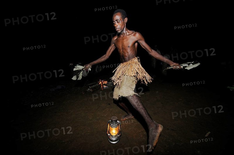 Pygmies of the Bakola people celebrating with song and dance