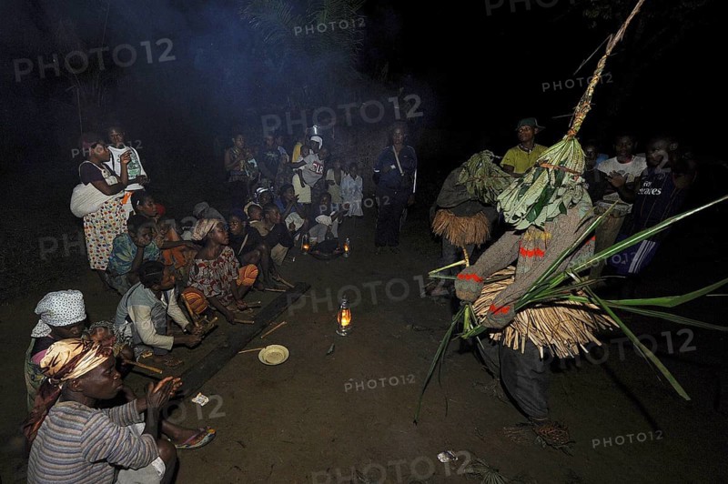 Pygmies of the Bakola people celebrating with song and dance