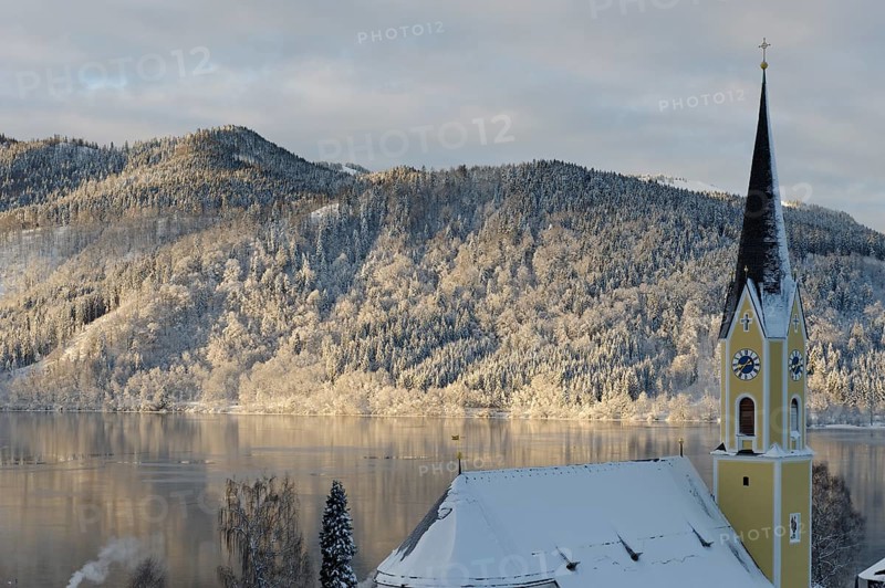 Lake Schliersee with the Church of St. Sixtus in winter
