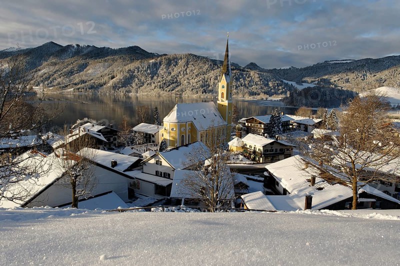 Lake Schliersee with the Church of St. Sixtus in winter