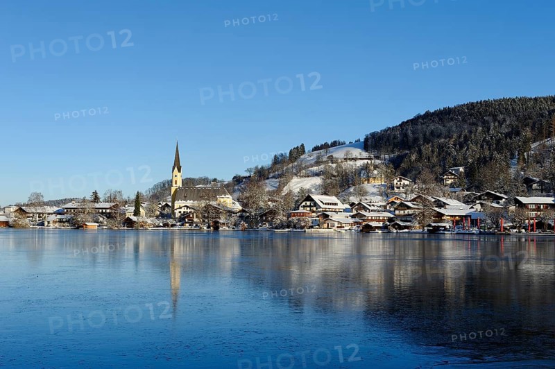 Lake Schliersee with the Church of St. Sixtus in winter