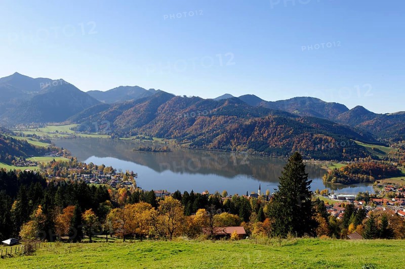 Lake Schliersee and the Parish Church of St. Sixtus as seen from Schliersberg mountain in autumn