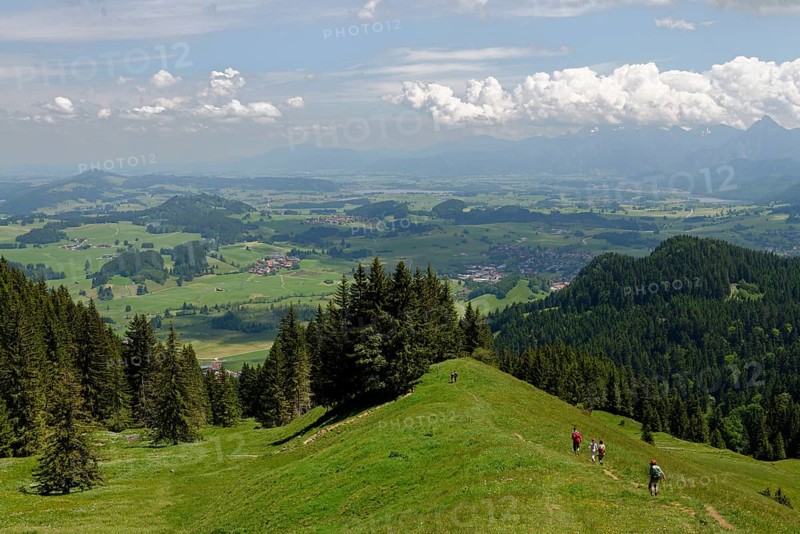 Climbers and views from Kappeler Alp below Mt Edelsberg and Mt Alpspitze
