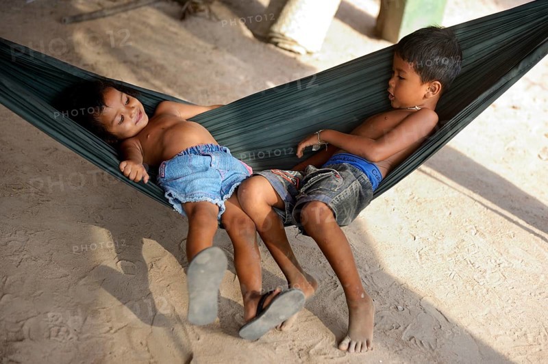 Boy and girl lying in a hammock