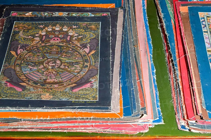 Pile of small Thangkas for sale in one of the art schools near Boudnath Stupa