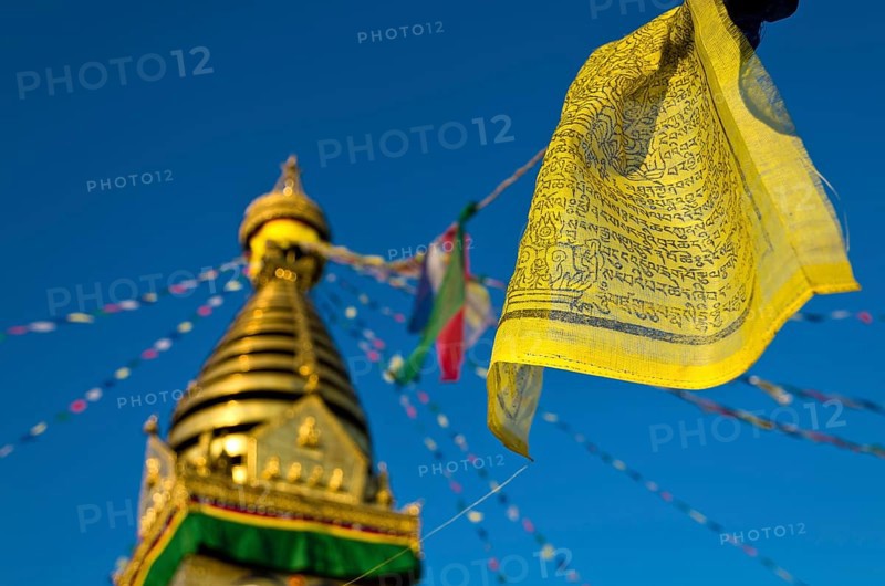 Yellow Buddhist prayer flag with Swayambhunath Stupa