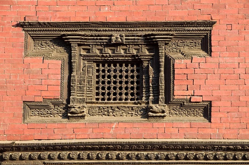 Beautifully carved wooden window of a temple