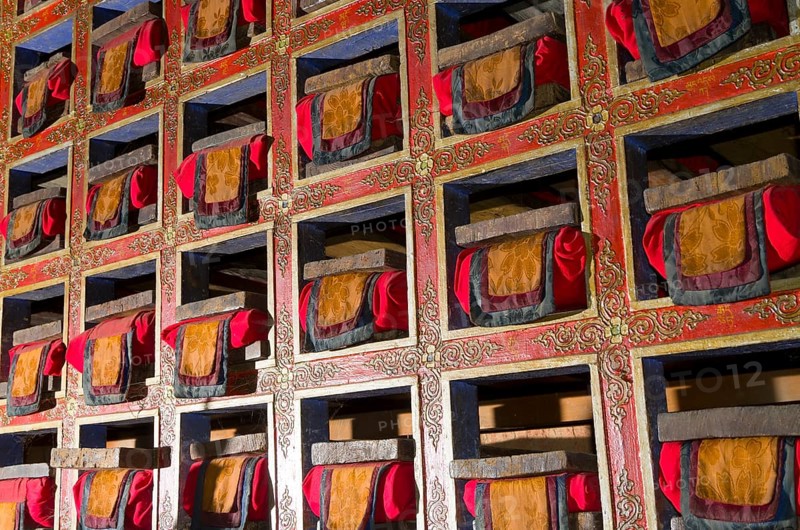 Colorful shelf with tibetean prayerbooks