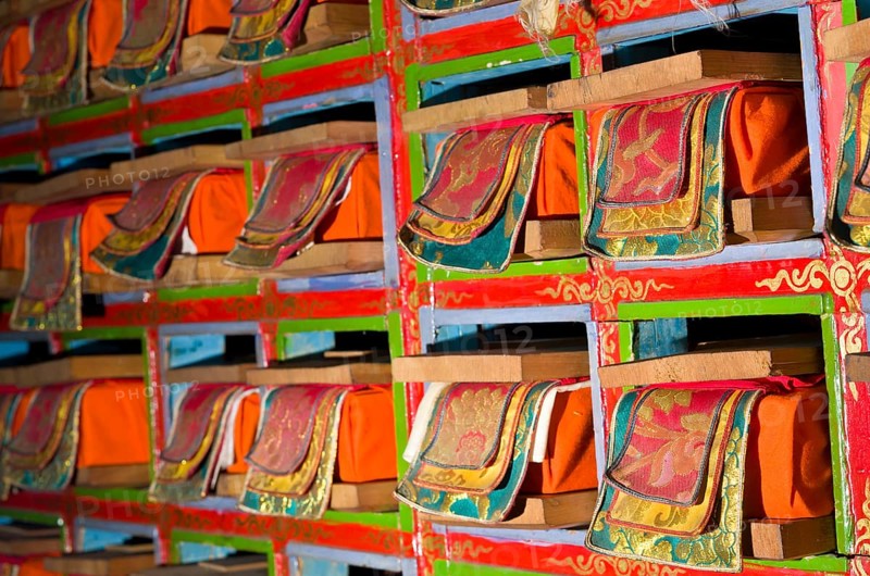 Colorful shelf with tibetean prayerbooks
