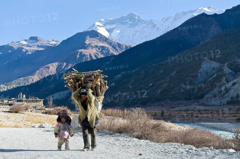 Woman walking with a small child