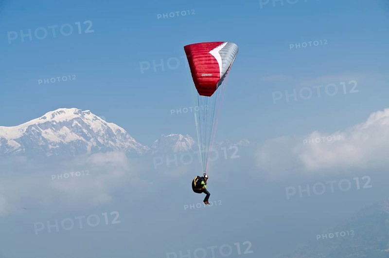 Paraglider sailing through the air